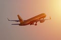 DHL Aviation jet up in the sky, orange sunset Royalty Free Stock Photo