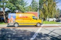 DHL van driving on the street Royalty Free Stock Photo