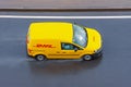 DHL world wide courier company delivery small cargo car on the highway city. Russia, Saint-Petersburg 15 may 2020 Royalty Free Stock Photo