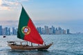 Dhow Boat on Corniche with Portugal Flag in Doha Qatar. Royalty Free Stock Photo