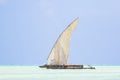 Dhow wooden boat with sail in a tropical clear blue sea at the Indian Ocean Royalty Free Stock Photo