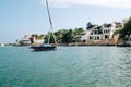 Dhows and boats moored at shore against buildings in Shela Beach, Lamu Island, Kenya