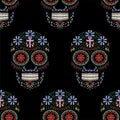 Seamless pattern with ornamented skulls on a black background