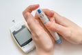 Diabetes concept. Diabetic patient is making blood glucose level