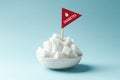 Diabetes concept, sugar cubes in white bowl with flag warning on blue background