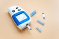 Diabetes, disease that is controlled with a glucometer, isolated on light background