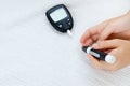 Diabetes and Glycemia. Blood sugar testing, child finger lancet punctures. Royalty Free Stock Photo