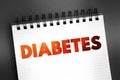 Diabetes - group of metabolic disorders characterized by a high blood sugar level over a prolonged period of time, text on notepad