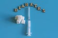 Diabetes inscription on a blue background. copy space