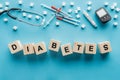 diabetes lettering made of wooden cubes with medical equipment Royalty Free Stock Photo