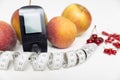 Diabetes monitor, diet and healthy food eating nutritional concept with clean fruits with diabetic measuring tool kit ans