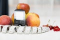 Diabetes monitor, diet and healthy food eating nutritional concept with clean fruits with diabetic measuring tool kit ans Royalty Free Stock Photo