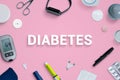 Diabetes top view, flat lay composition with text surrounded by tools and supplies