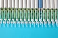 Diabetic insulin pens lined up on a blue background. Provision o