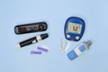 Diabetic kit: two types of glucometers, test strips, lancet. Royalty Free Stock Photo