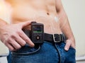 Diabetic man with an insulin pump connected in his abdomen Royalty Free Stock Photo