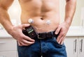 Diabetic man with an insulin pump connected in his abdomen Royalty Free Stock Photo