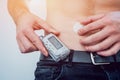 Diabetic man with an insulin pump connected in his abdomen Royalty Free Stock Photo