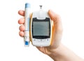 Diabetic patient holds glucometer and needle in hand. Isolated.