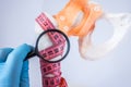 Diagnosis of bone density and presence of osteoporosis photo idea. Doctor examines through magnifying indicators measuring tape wr