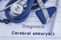 The diagnosis of Cerebral aneurysm. Paper medical history with diagnosis of Cerebral aneurysm, on which lie stethoscope, neurologi