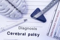 Diagnosis Cerebral palsy. Figure brain, neurological hammer, printed on a paper blood test and written diagnosis of Cerebral palsy Royalty Free Stock Photo