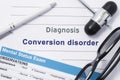 Diagnosis Conversion disorder. Medical note surrounded by neurologic hammer, mental status exam with name in large letters psychia Royalty Free Stock Photo