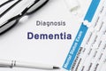 Diagnosis of Dementia. Results of mental status exam, container with crumbled pills with inscription psychiatric diagnosis Dementi