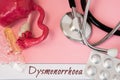 Diagnosis of Dysmenorrhea. Medical history of patient with Diagnosis of Dysmenorrhea inscription next stethoscope, uterus with ova