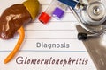 Diagnosis Glomerulonephritis photo. Figure of kidney lies next to incription of diagnosis of glomerulonephritis, result of ultras