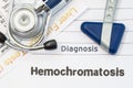 Diagnosis Hemochromatosis. Neurological hammer, stethoscope and liver laboratory test lie on note with title of hereditary disease