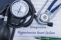 Diagnosis Hypertensive heart failure. A stethoscope, sphygmomanometer with a cuff lie on medical form documentation with diagnosis