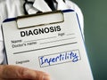 Diagnosis Infertility concept. Doctor holds medical form