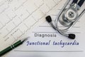 Diagnosis of Junctional tachycardia. Stethoscope, and electrocardiogram lie on medical form with diagnosis of Junctional tachycard