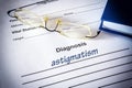 Diagnosis list with Astigmatism and glasses Royalty Free Stock Photo