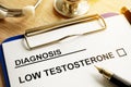 Diagnosis Low testosterone on a desk. Royalty Free Stock Photo