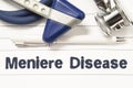 Diagnosis of Meniere Disease closeup. Medical book guide for doctor neurologist with heading text of inner ear disorder Meniere Di