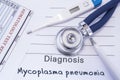 Diagnosis of Mycoplasma Pneumonia. Stethoscope, electronic thermometer, blood test results are on medical form, which indicated di Royalty Free Stock Photo