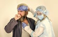 Diagnosis of pneumonia. Doctor protective equipment examines patient suspected coronavirus infection. Virulent Royalty Free Stock Photo