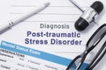 Diagnosis Posttraumatic Stress Disorder. Medical note surrounded by neurologic hammer, mental status exam with an inscription in l
