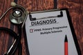 Diagnosis - PPMS. Primary Progressive Multiple Sclerosis write on paperwork isolated on wooden table