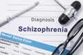 Diagnosis Schizophrenia. Medical note surrounded by neurologic hammer, mental status exam with an inscription in large letters psy Royalty Free Stock Photo