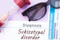 Diagnosis of Schizotypal Disorder. Hourglass, doctor glasses, mental status exam are near inscription Schizotypal Disorder. Causes