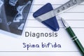 Diagnosis of Spina Bifida. Medical health history written with diagnosis of Spina Bifida, MRI image sacral spine and neurological Royalty Free Stock Photo