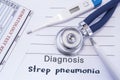 Diagnosis of strep pneumonia. Stethoscope, electronic thermometer, common blood test results are on medical form, which indicated Royalty Free Stock Photo
