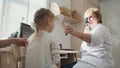 Diagnostic in child`s ophthalmology - optometrist diagnosis little girl