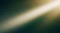 Diagonal golden light beam illuminating a dark green blurred abstract background with subtle textures and soft gradients Royalty Free Stock Photo