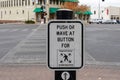 Diagonal crosswalk sign and button Royalty Free Stock Photo