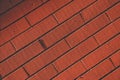 Diagonal dark orange - brown brick wall