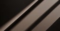Diagonal light beams creating abstract shapes on textured brown paper, highlighting a captivating interplay of light and shadow Royalty Free Stock Photo
